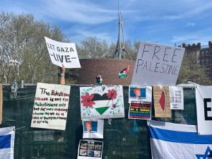 SIGNS FROM THE MAY 2024 PROTEST THAT SAY LET GAZA LIVE AND FREE PALESTINE, FLAG OF ISRAEL